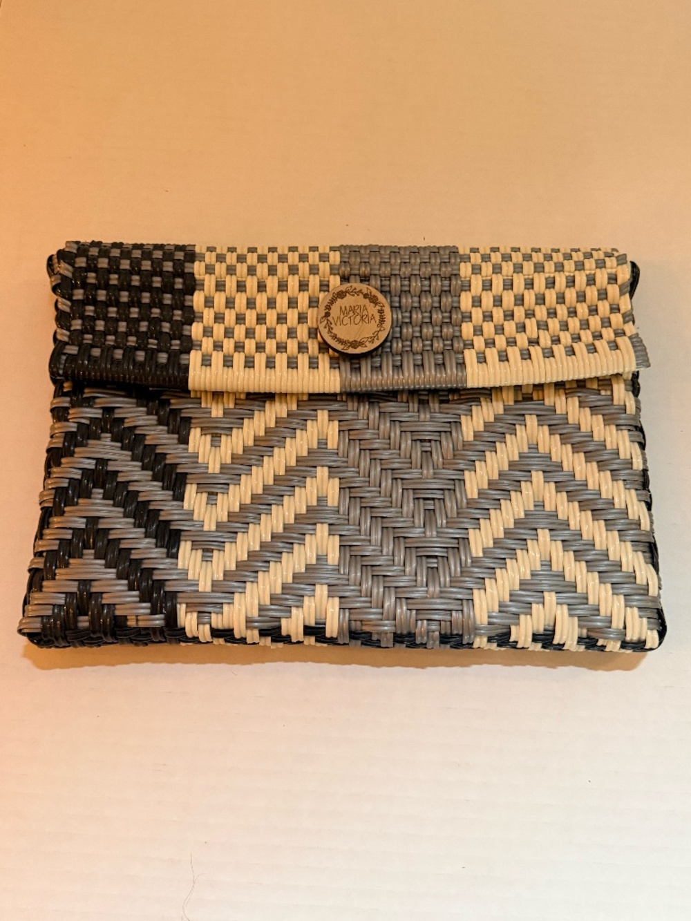 Maria Victoria clutch in black, silver and ivory woven PVC/Vinyl.